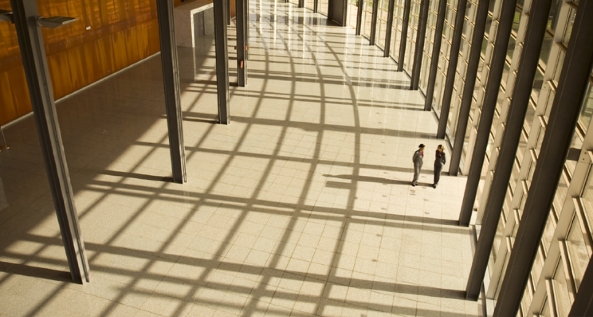 A corporate building's interior representing dispute resolution and litigation in relation to the duomatic principle.